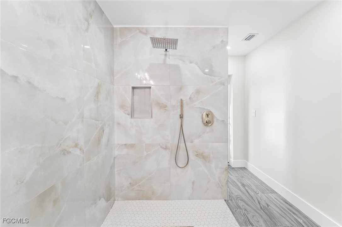 12860 Iona Road Fort Myers, FL 33908 - Photo 30 of 44 a bathroom with a shower