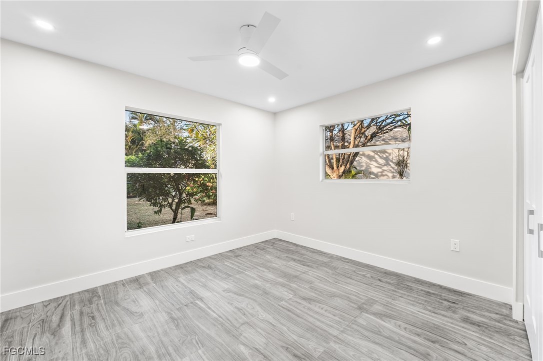 12860 Iona Road Fort Myers, FL 33908 - Photo 32 of 44 an empty room with windows and closet