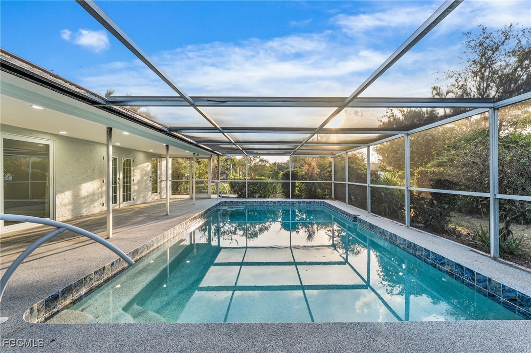 12860 Iona Road Fort Myers, FL 33908 - Photo 6 of 44 a view of swimming pool with seating area