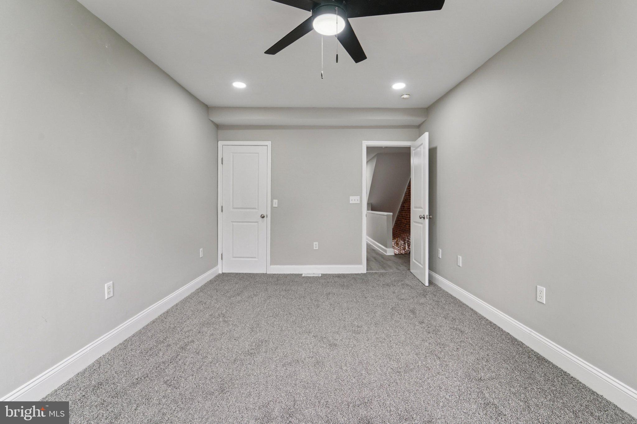 1525 West Pratt Street Baltimore, MD 21223 - Photo 12 of 31 an empty room with a ceiling fan and entryway