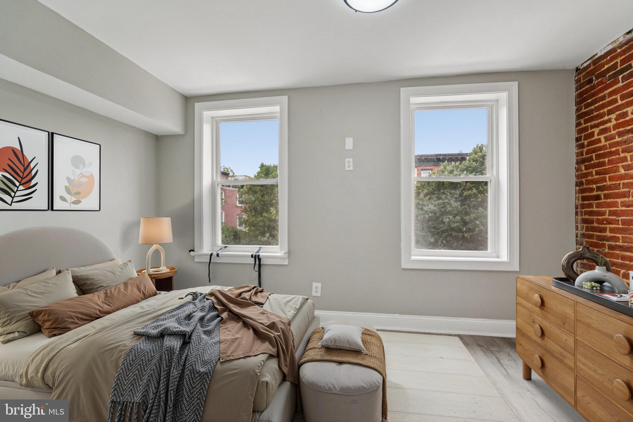 1525 West Pratt Street Baltimore, MD 21223 - Photo 14 of 31 a bed room with a bed and a window