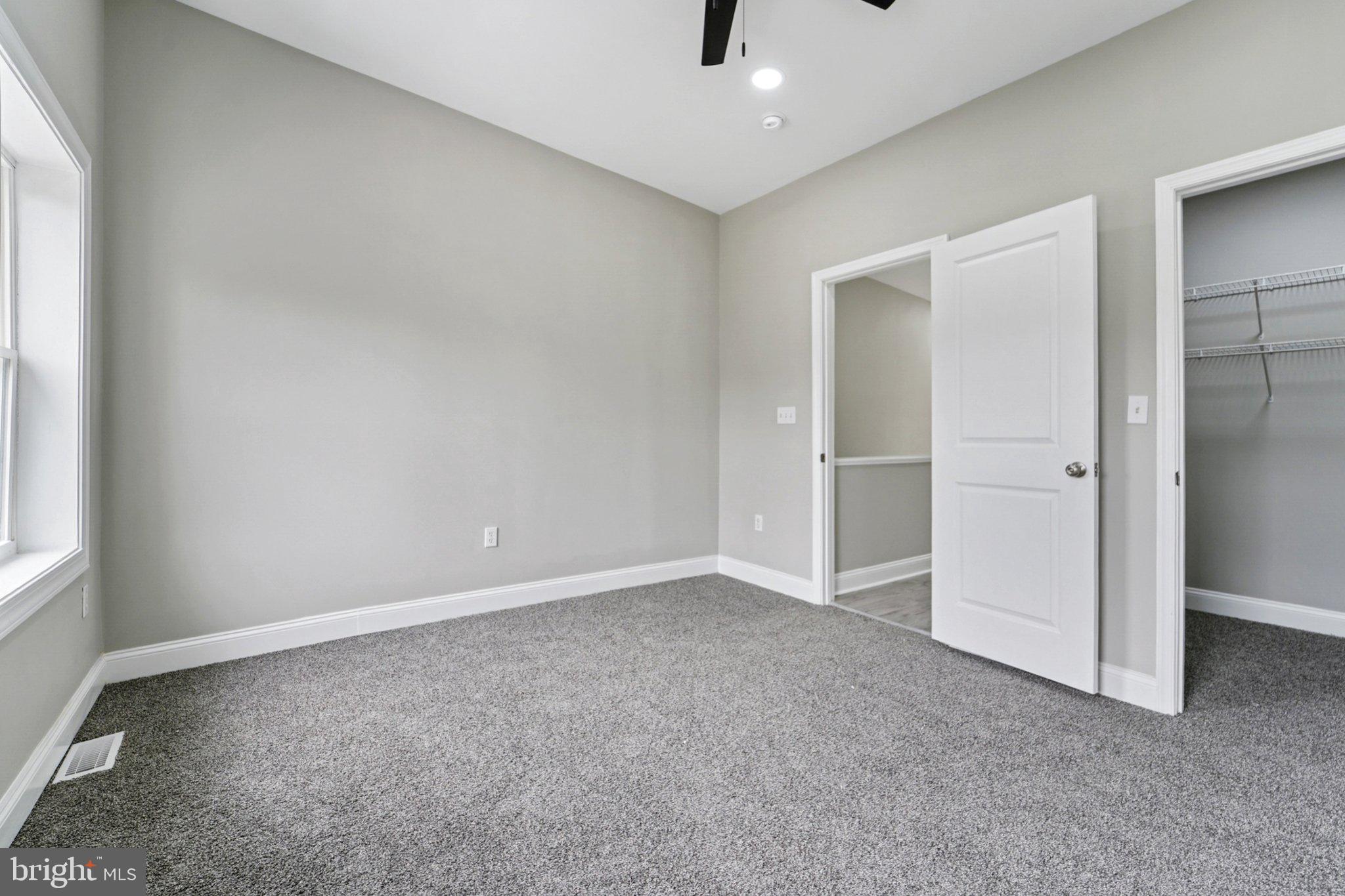 1525 West Pratt Street Baltimore, MD 21223 - Photo 19 of 31 an empty room with closet and windows