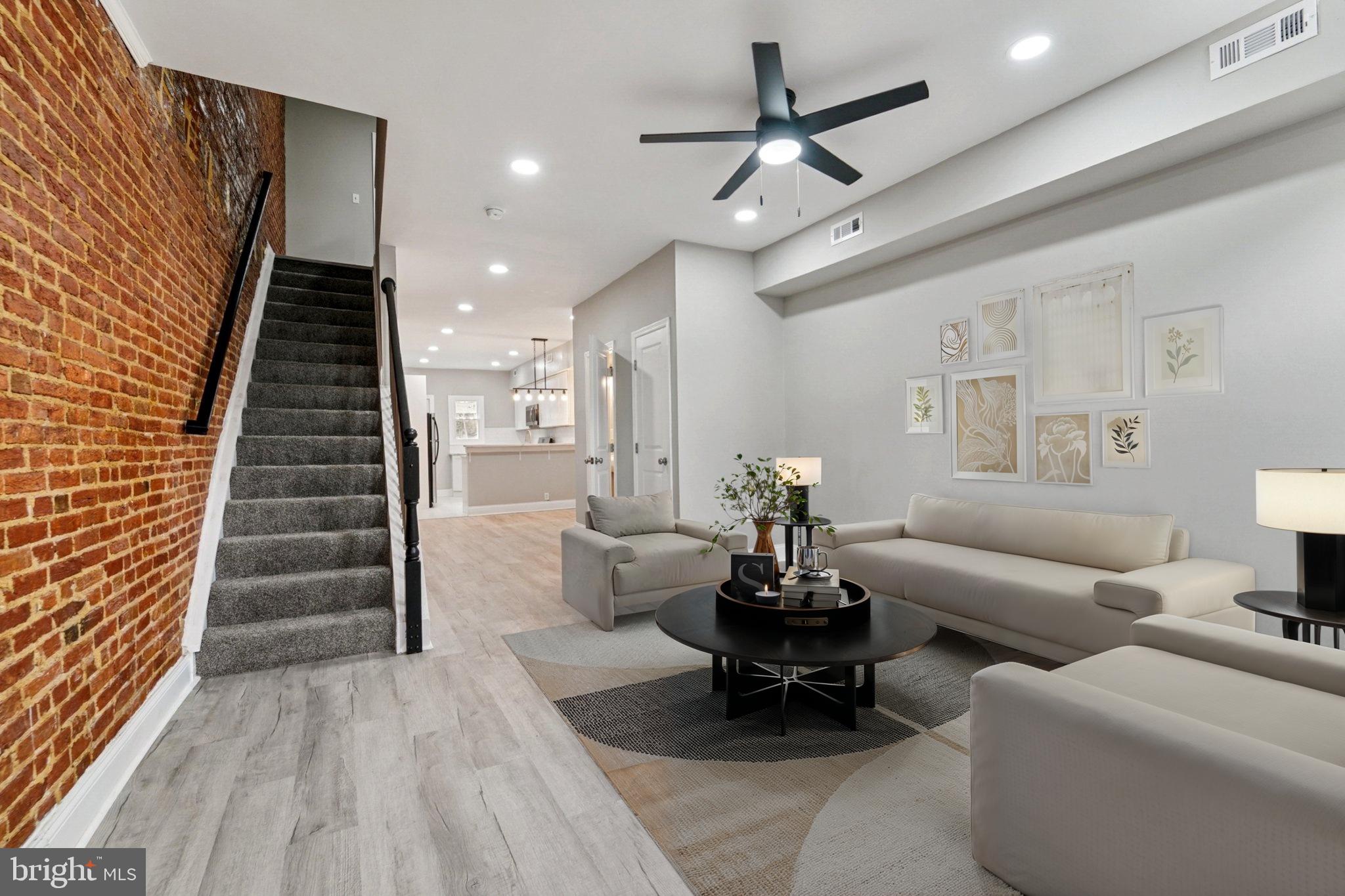 1525 West Pratt Street Baltimore, MD 21223 - Photo 4 of 31 a living room with furniture and wooden floor