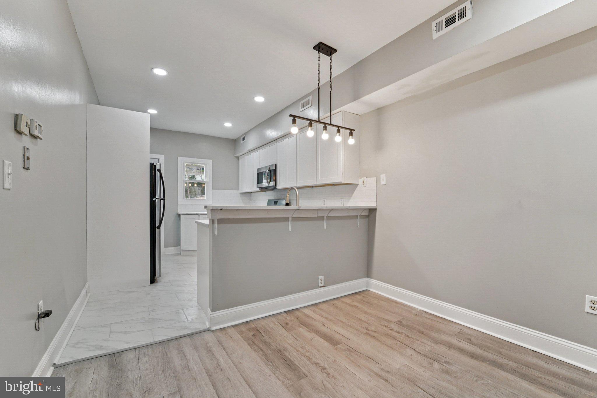 1525 West Pratt Street Baltimore, MD 21223 - Photo 6 of 31 a view of a kitchen with a sink and dishwasher