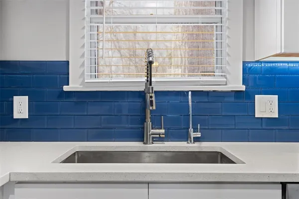 a view of a sink and a window