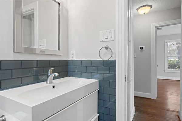 a bathroom with a sink and a mirror