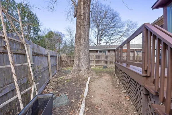 a view of a pathway with a backyard