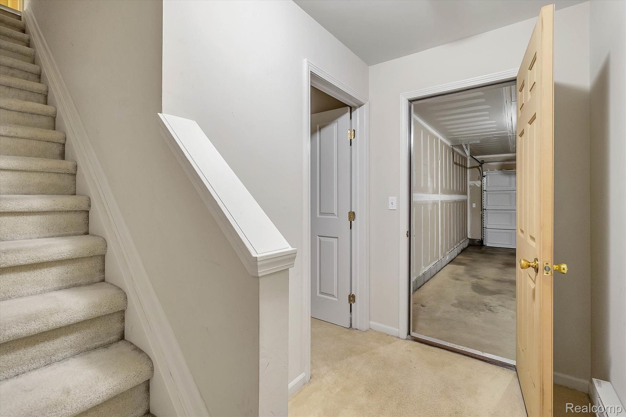 4069 Hampton Ridge Boulevard Howell, MI 48843 - Photo 17 of 30 access to the garage and another storage space through the door on the left