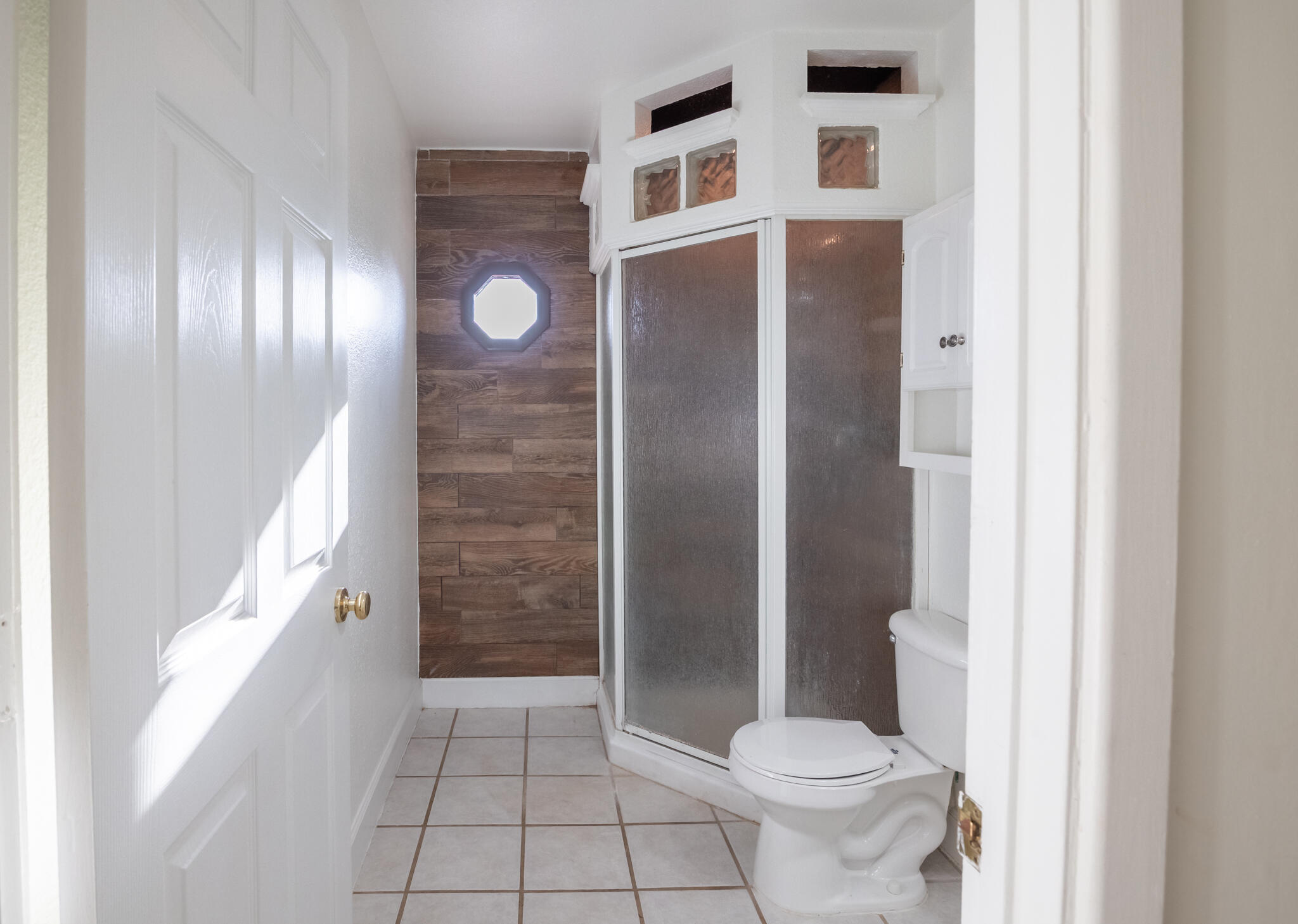 6917 Highway 114 Lubbock, TX 79407 - Photo 25 of 45 a bathroom with a toilet and a shower