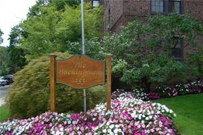 253 Garth Road, Unit 2J Scarsdale, NY 10583 - Photo 1 of 1 a sign that is in front of flowers