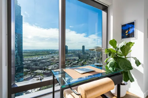 a view of a room with furniture and window