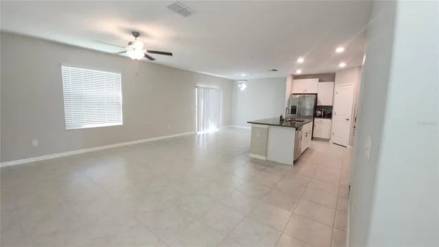 a view of a kitchen with a sink and cabinets