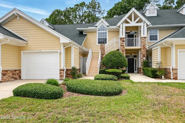 a front view of a house with garden