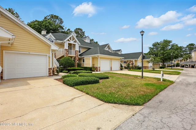 an aerial view of a house with a swimming pool
