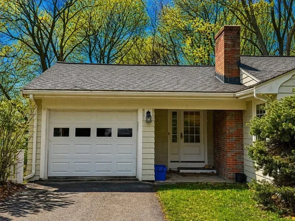 a view of a house with a tree