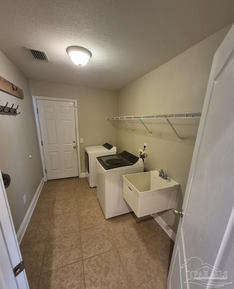 1960 Amhurst Court Navarre, FL 32566 - Photo 22 of 47 a bathroom with a sink a toilet and shower