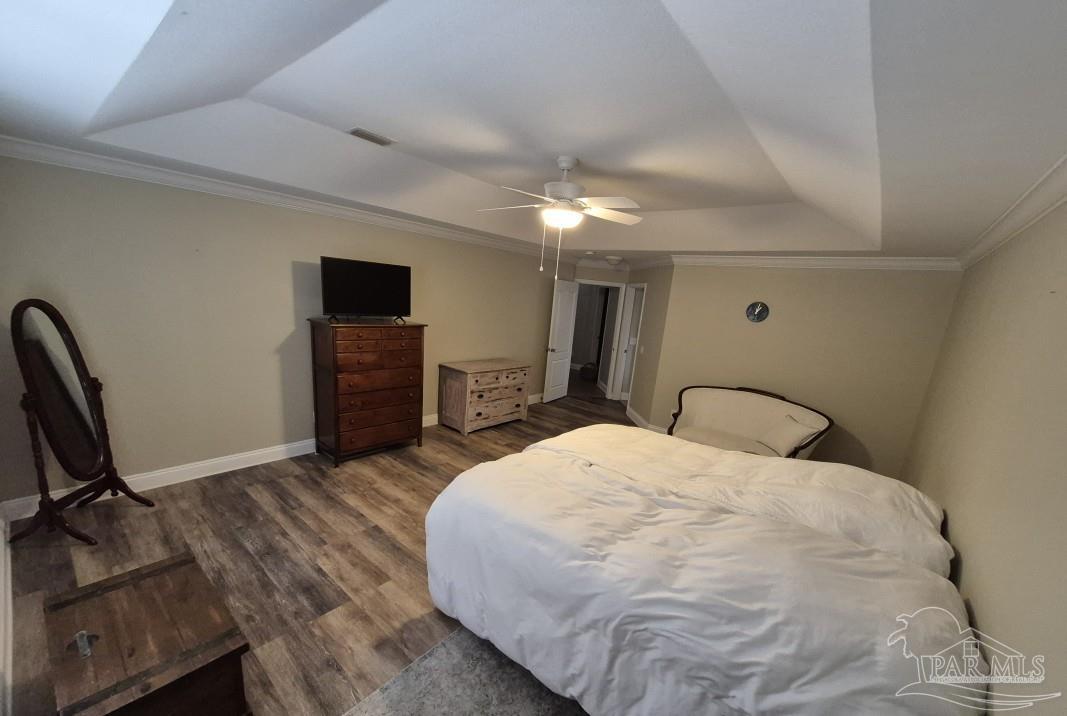 1960 Amhurst Court Navarre, FL 32566 - Photo 25 of 47 a spacious bedroom with a bed and a flat screen tv