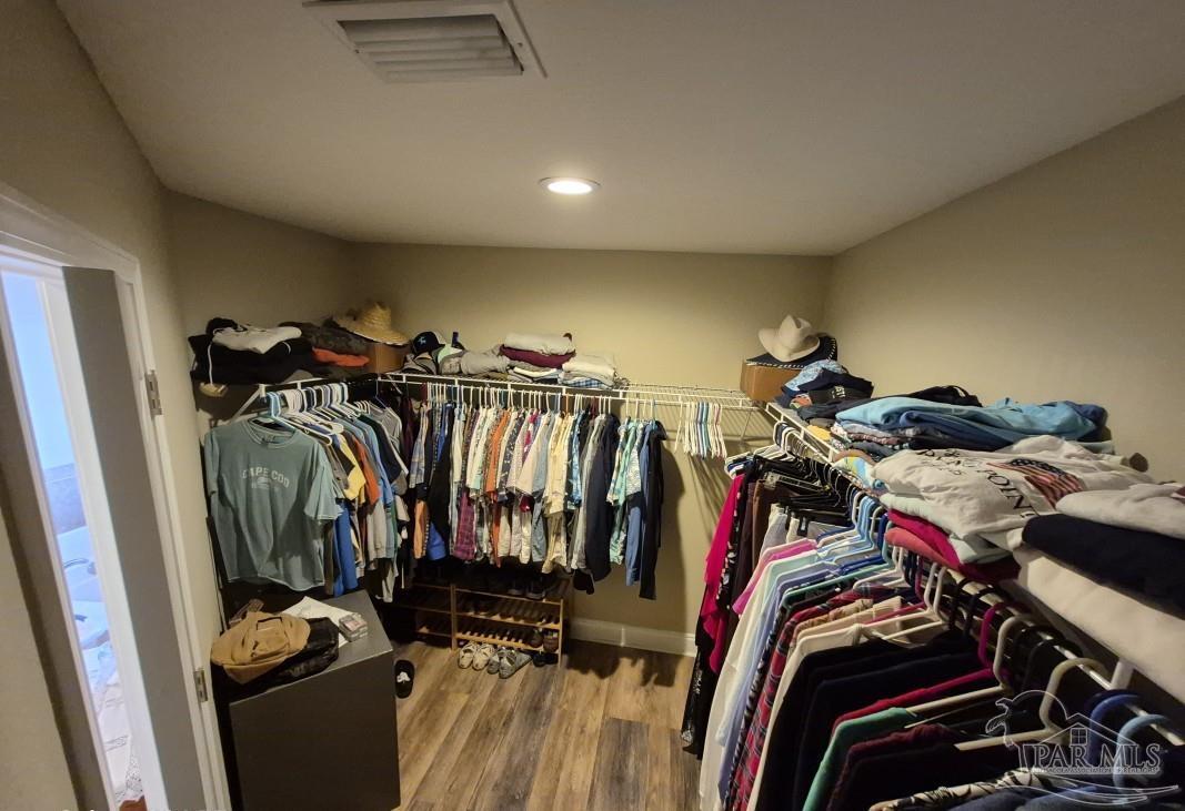 1960 Amhurst Court Navarre, FL 32566 - Photo 27 of 47 a view of a closet with storage