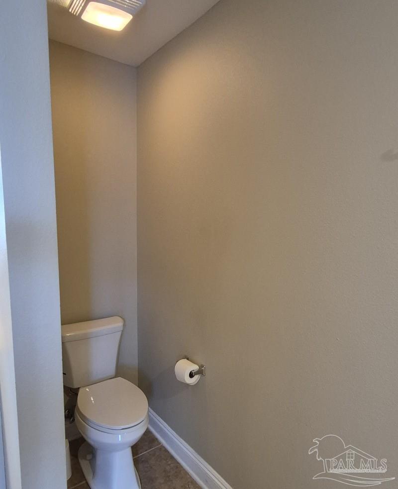 1960 Amhurst Court Navarre, FL 32566 - Photo 30 of 47 a white toilet sitting next to a white wall