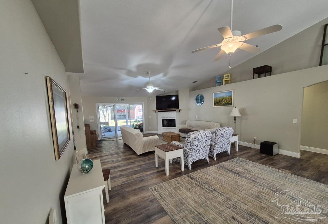 1960 Amhurst Court Navarre, FL 32566 - Photo 4 of 47 a living room with fireplace furniture and a flat screen tv