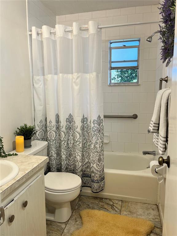 740 East Pearl Street, Unit C Bartow, FL 33830 - Photo 18 of 20 a bathroom with a sink a toilet and shower