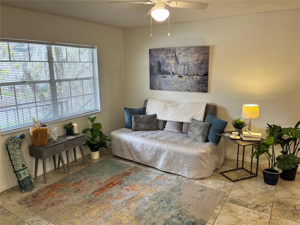 740 East Pearl Street, Unit C Bartow, FL 33830 - Photo 6 of 20 a living room with furniture and a lamp