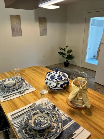 a table with a vase and flowers on it