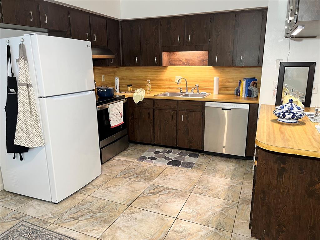 740 East Pearl Street, Unit C Bartow, FL 33830 - Photo 8 of 20 a kitchen with a refrigerator sink and cabinets