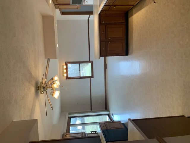 a view of staircase with wooden floor