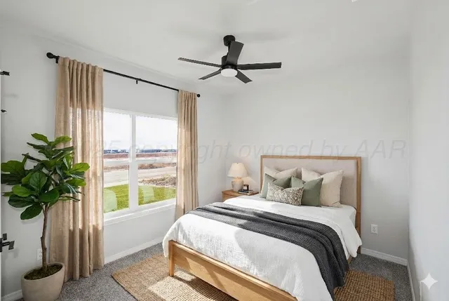 a bedroom with furniture and a window