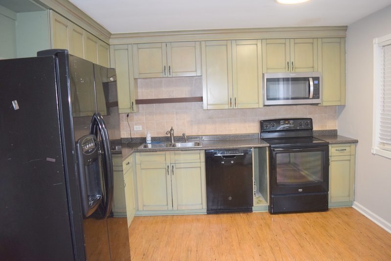1652 Greenwood Road Glenview, IL 60026 - Photo 3 of 15 a kitchen with stainless steel appliances granite countertop a refrigerator and a stove