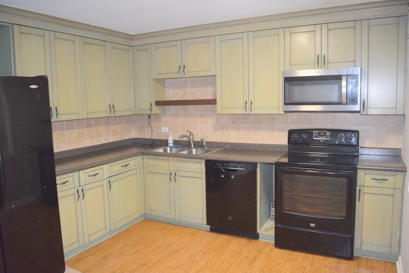 1652 Greenwood Road Glenview, IL 60026 - Photo 4 of 15 a kitchen with granite countertop a sink and cabinets