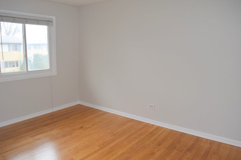 1652 Greenwood Road Glenview, IL 60026 - Photo 10 of 15 wooden floor in an empty room with a window
