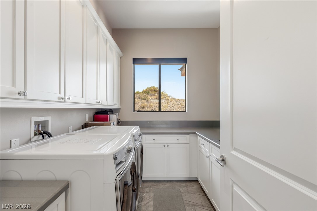 5 Crystal Tree Pass Henderson, NV 89052 - Photo 38 of 67 Ample cabinetry and generous countertop space make this utility room both practical and stylish.