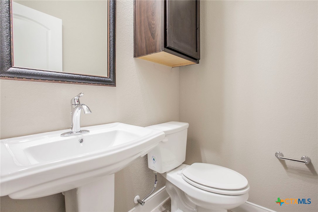 549 Wills Point Way Belton, TX 76513 - Photo 28 of 31 a bathroom with a sink a toilet and mirror