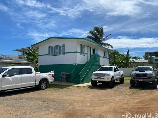 a view of a car parked in front of a house