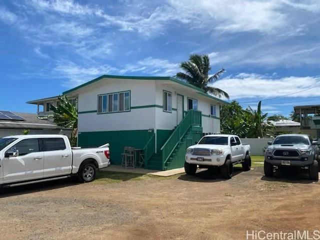 a view of a car parked in front of a house
