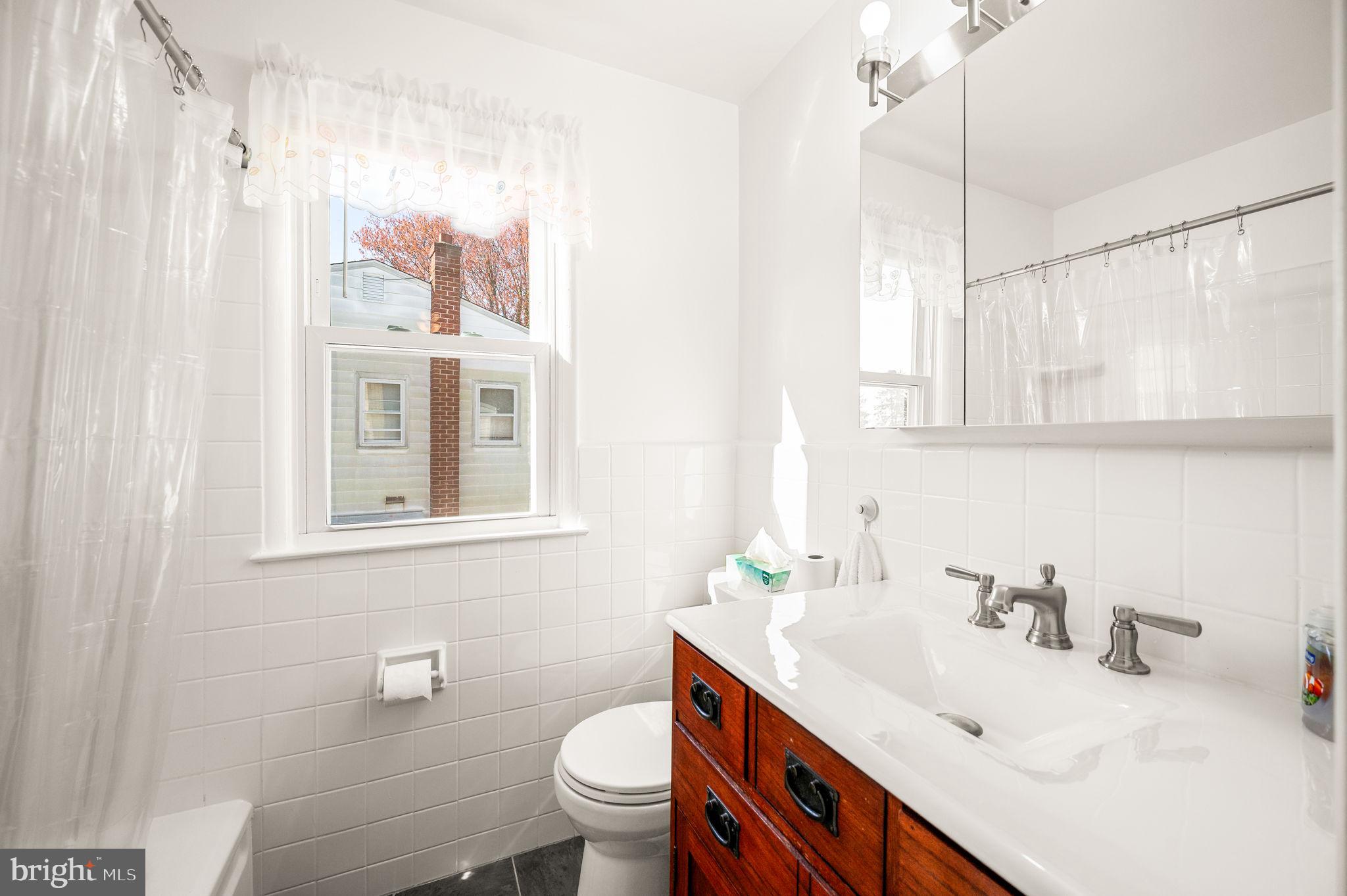 1565 Parklane Road Swarthmore, PA 19081 - Photo 21 of 28 a bathroom with a sink toilet and shower