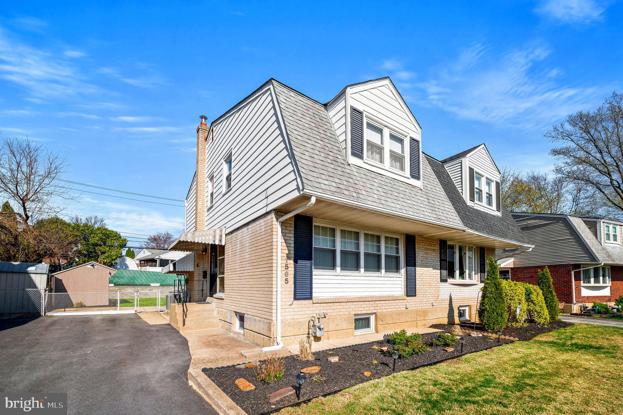 1565 Parklane Road Swarthmore, PA 19081 - Photo 3 of 28 a front view of a house with a yard