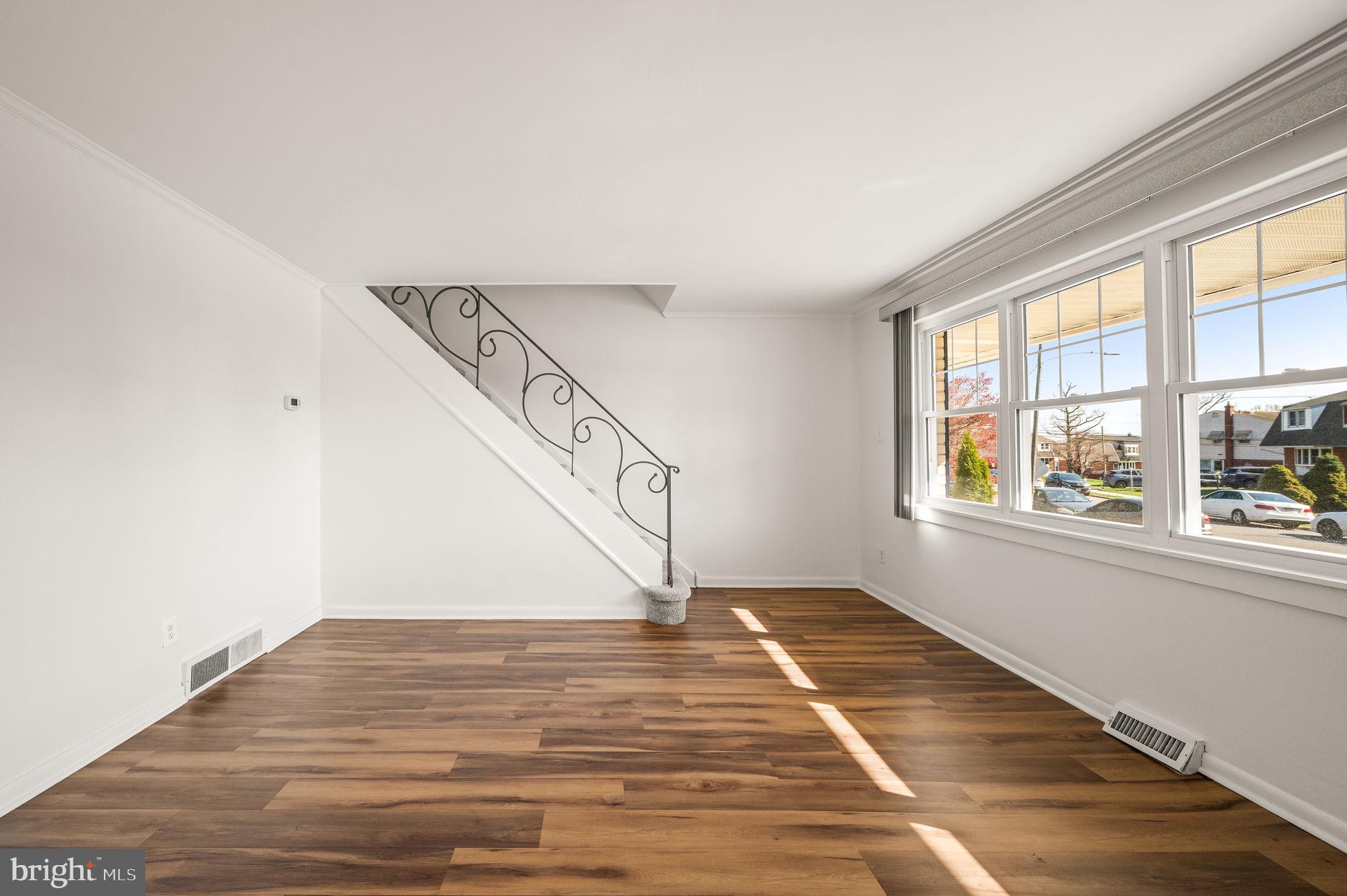1565 Parklane Road Swarthmore, PA 19081 - Photo 6 of 28 a view of entryway and hall with wooden floor