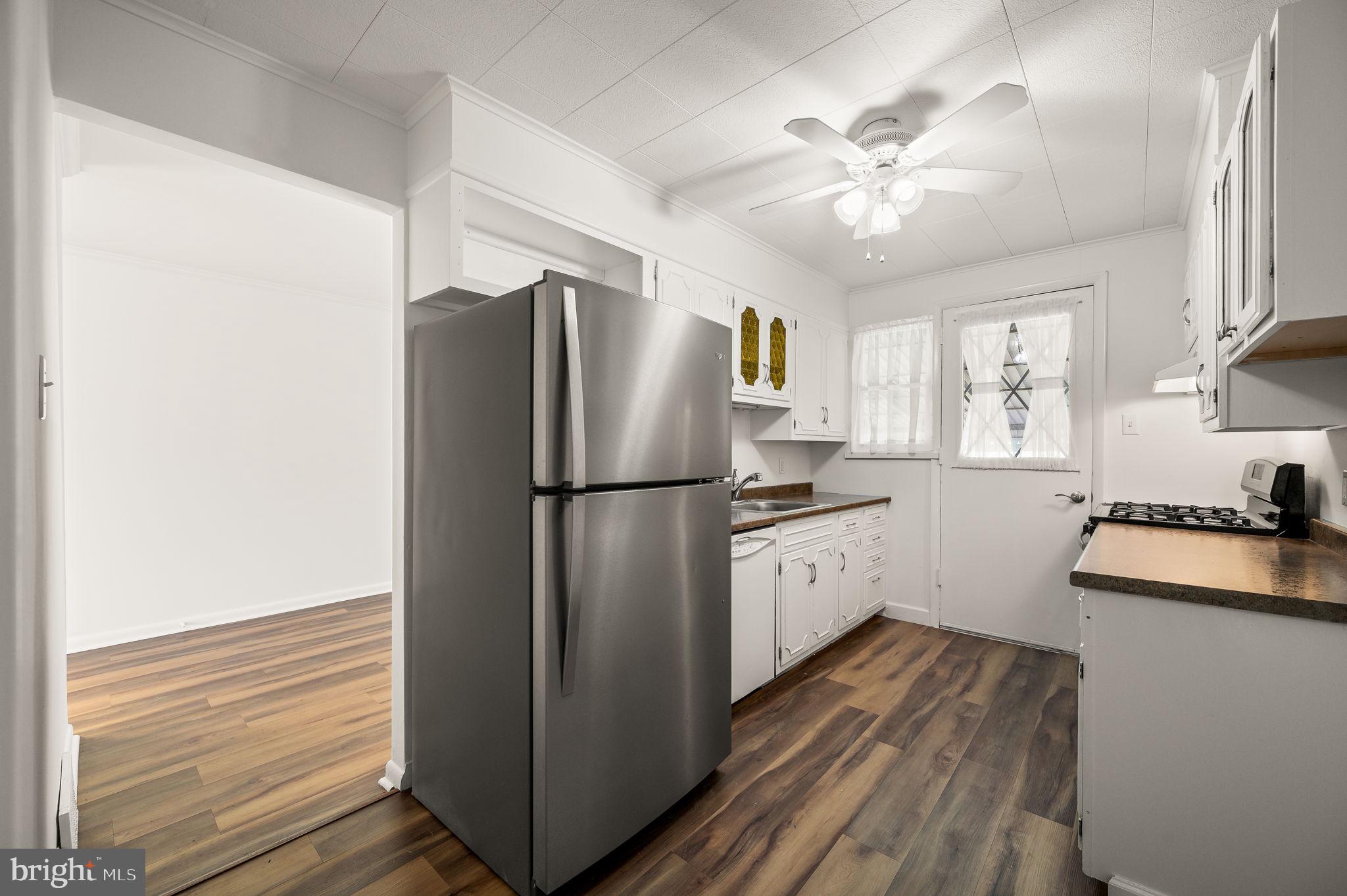 1565 Parklane Road Swarthmore, PA 19081 - Photo 9 of 28 a kitchen with a refrigerator and a sink