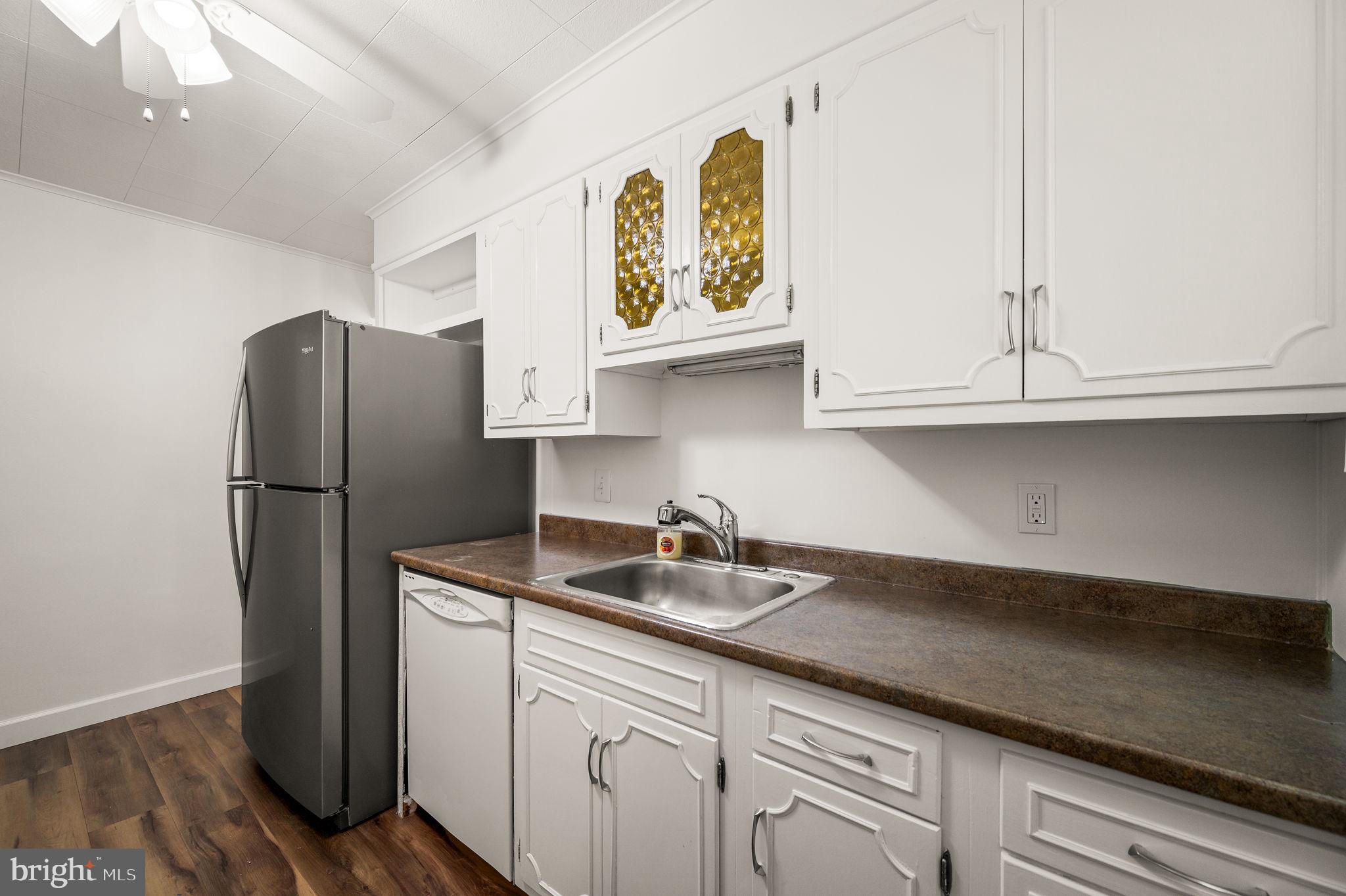 1565 Parklane Road Swarthmore, PA 19081 - Photo 10 of 28 a kitchen with stainless steel appliances granite countertop a refrigerator and a sink