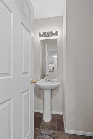 a bathroom with a sink and mirror