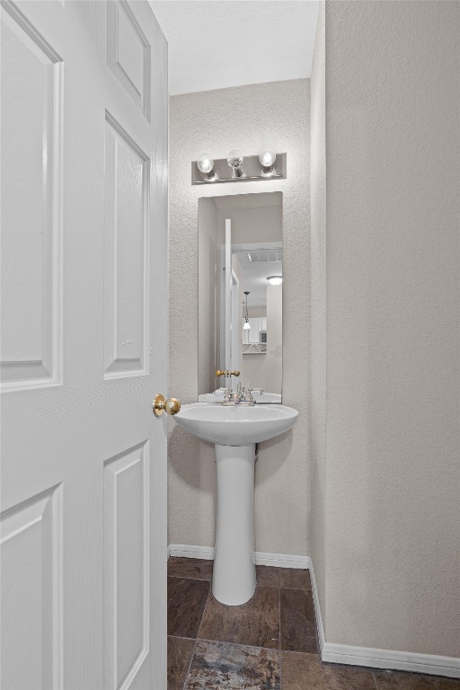 154 Meadowlark Circle Georgetown, TX 78626 - Photo 16 of 29 a bathroom with a sink and mirror