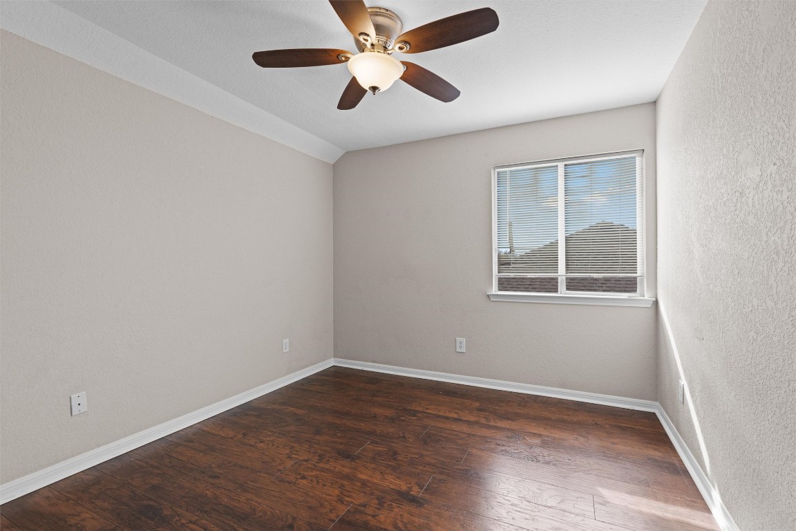 154 Meadowlark Circle Georgetown, TX 78626 - Photo 17 of 29 an empty room with wooden floor and windows