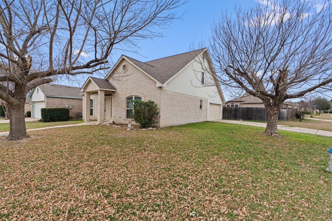 154 Meadowlark Circle Georgetown, TX 78626 - Photo 2 of 29 a front view of a house with a yard and garage