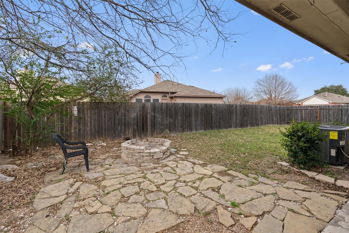 154 Meadowlark Circle Georgetown, TX 78626 - Photo 23 of 29 a backyard of a house with table and chairs