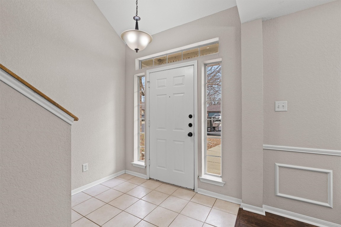 154 Meadowlark Circle Georgetown, TX 78626 - Photo 3 of 29 an empty room with windows and wooden floor
