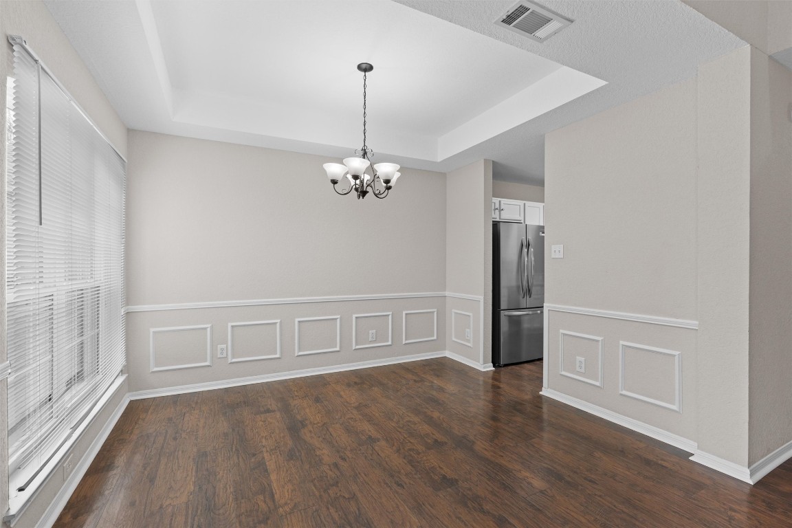 154 Meadowlark Circle Georgetown, TX 78626 - Photo 4 of 29 wooden floor in an empty room with a window