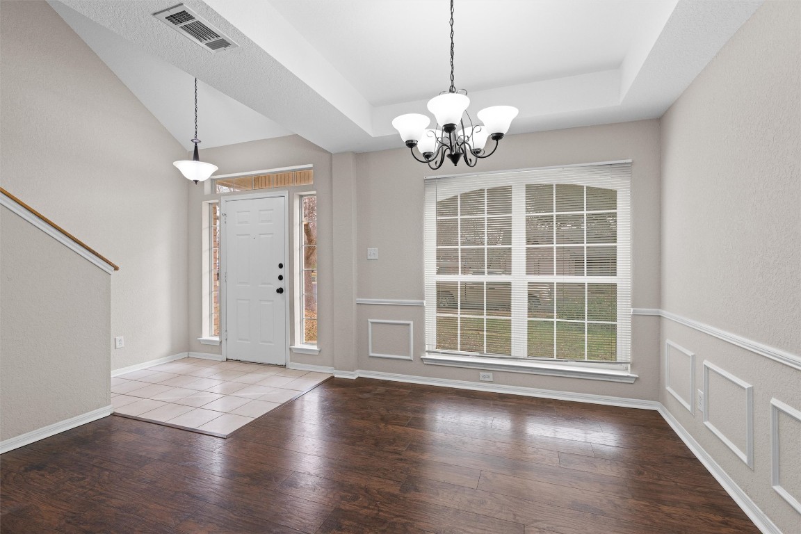 154 Meadowlark Circle Georgetown, TX 78626 - Photo 5 of 29 a view of an empty room with wooden floor and a window